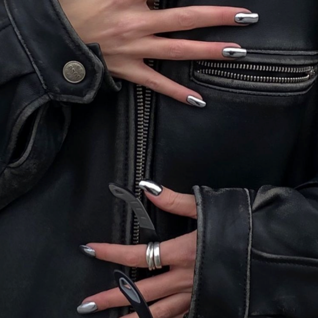 girl with black jacket with metallic silver chrome nails 