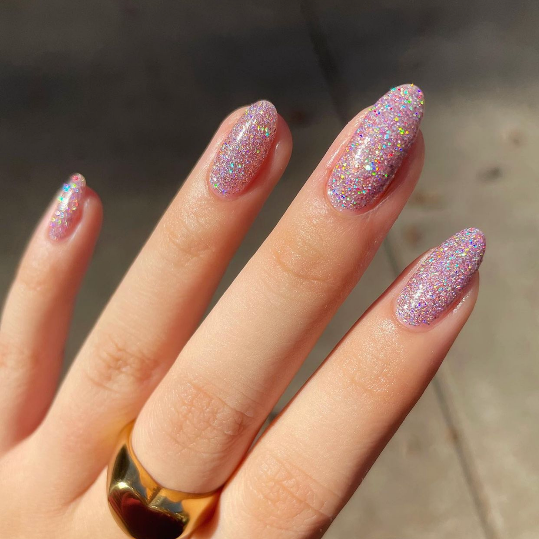 pink and purple holographic glitter almond shaped nails 