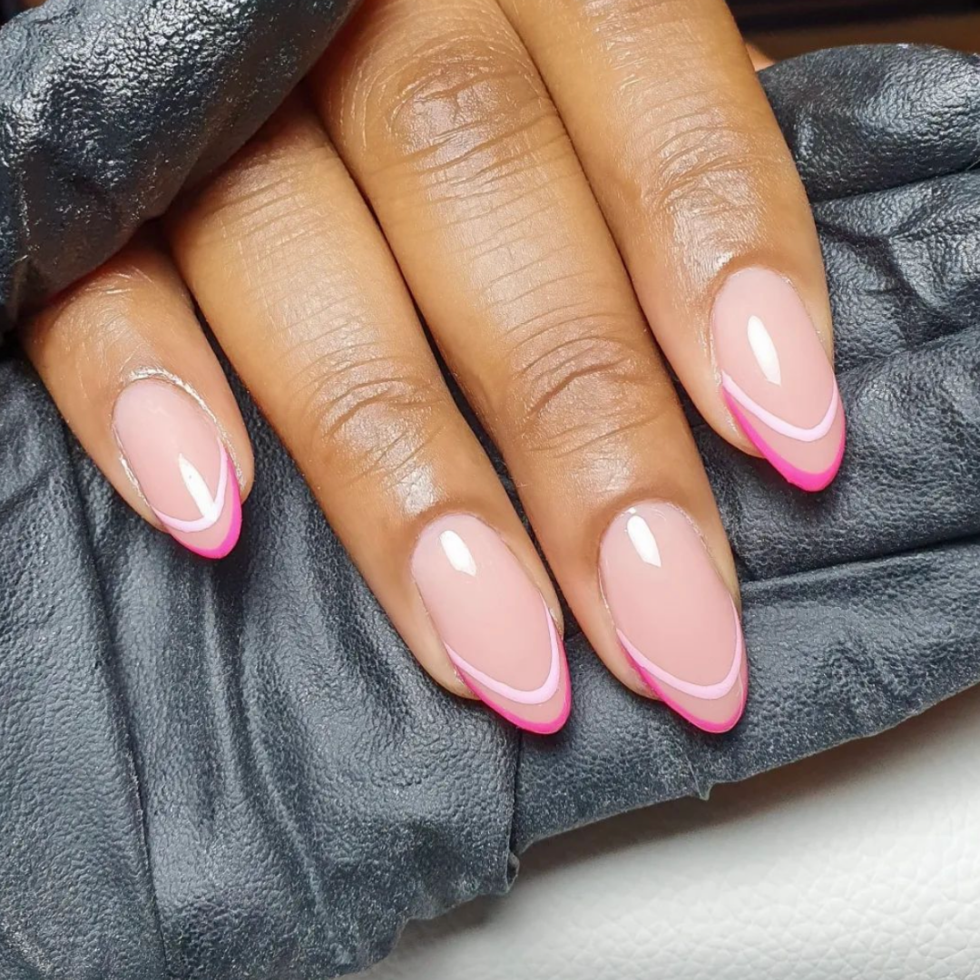 double french outline manicure with light and dark pink polish on almond nails