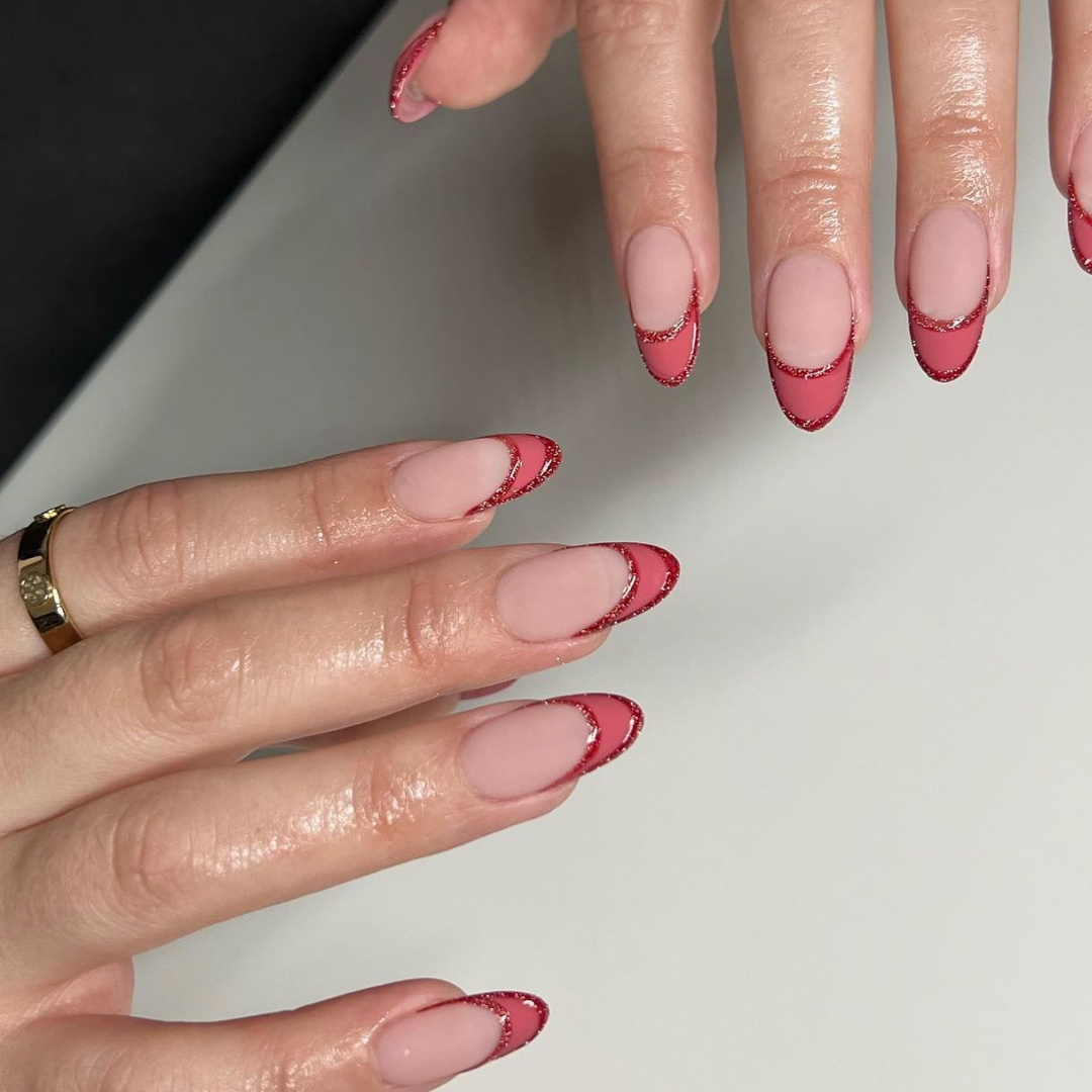 dark pink french tip manicure with double french outline in glitter polish