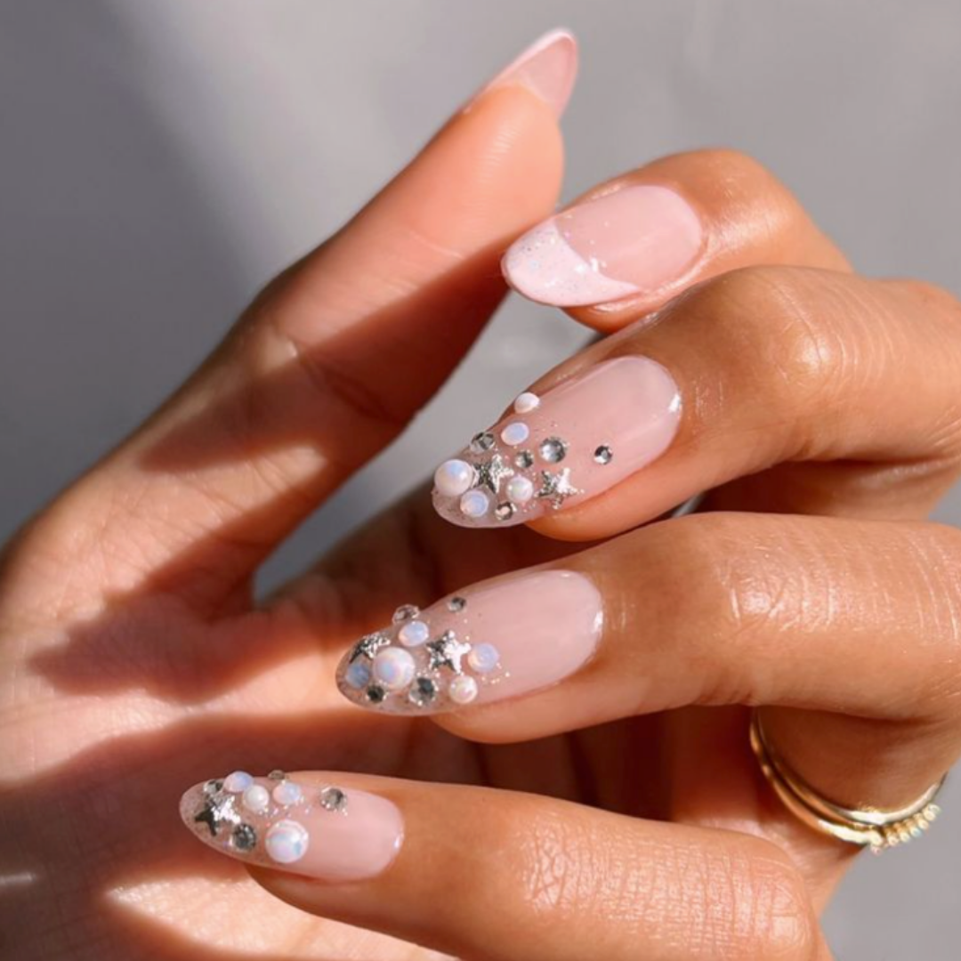 manicured nails with assortment of pearl embellishments 