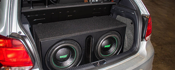 two subwoofers in a car boot
