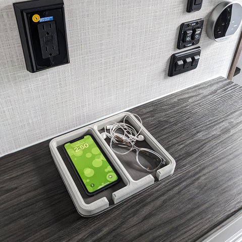 ITC Dash Tray on a RV counter top with a phone, glasses, and headphones nicely organized