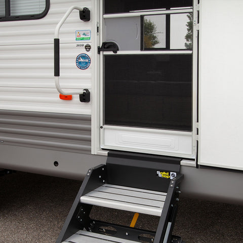 White Stow and Go handle installed on the side of a travel trailer | ITC Shop Now