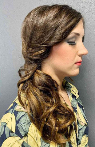 2. Side-Swept Low Ponytail