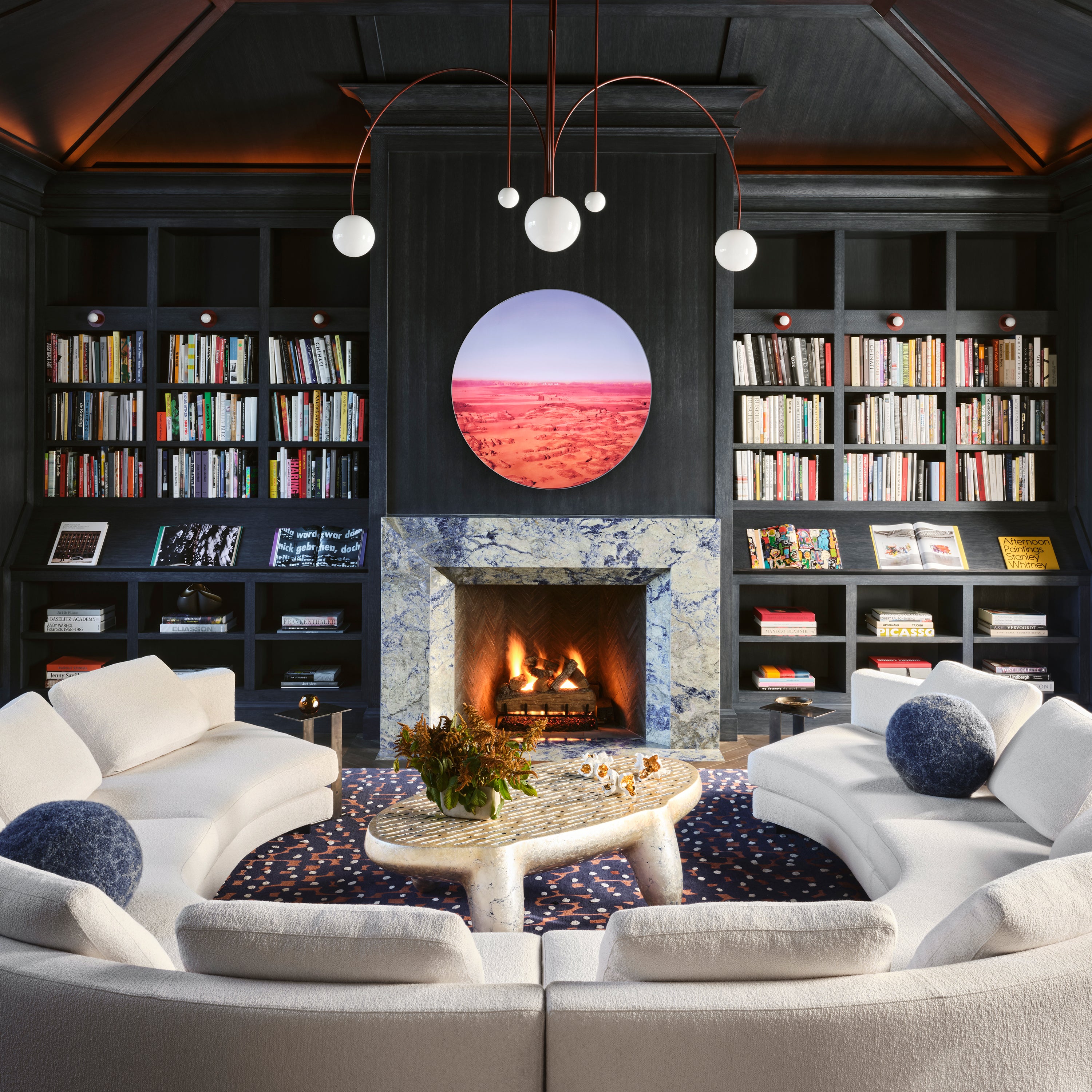 <p>Family room designed by Nicole Hollis, featuring library curated by Douglas Flamm. Artwork: Doug Aitken, <em>I’ll be right back. . . Aperture Series</em>, 2019 © Doug Aitken. Photo: Douglas Friedman/Trunk Archive</p>