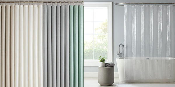 Shower curtains and clear liner in a modern bathroom