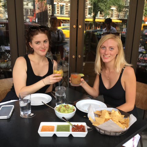 Amelia and her sister Sophia enjoying cocktails, guacamole and tortillas chips in NYC.