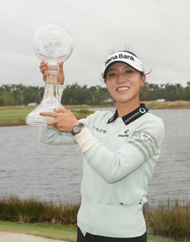 Lydia posing with trophies