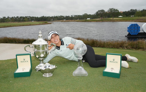Lydia posing with trophies