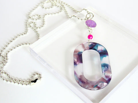 photo of Viola Necklace from Leo and Lynn Jewelry handmade resin jewelry Pittsburgh statement necklace spring style casual style purple blue acrylic hot pink crystal purple glitter