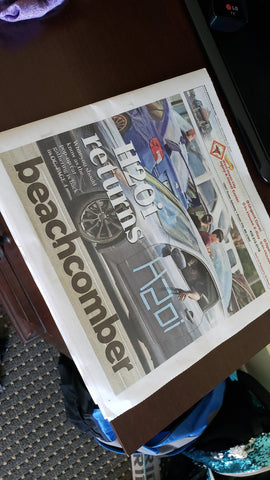 front page of newspaper with h2o and car enthusiast driving a g35 infiniti to car meet in ocean city md with subaru in background