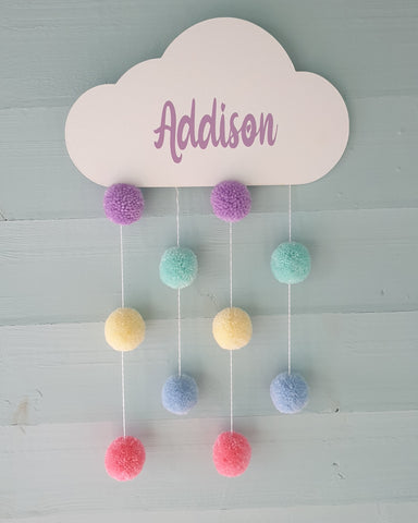 Cloud with hanging pompoms attached with name