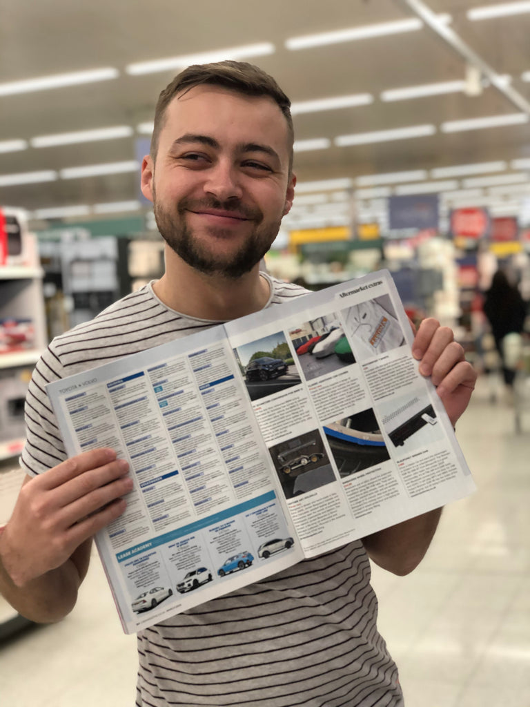 Takona Founder Lewis Warren Holding up a copy of CAR Magazine featuring Takona.