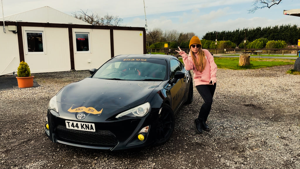 Grace stood next to our GT86 at Cars and Coffee Cheshire