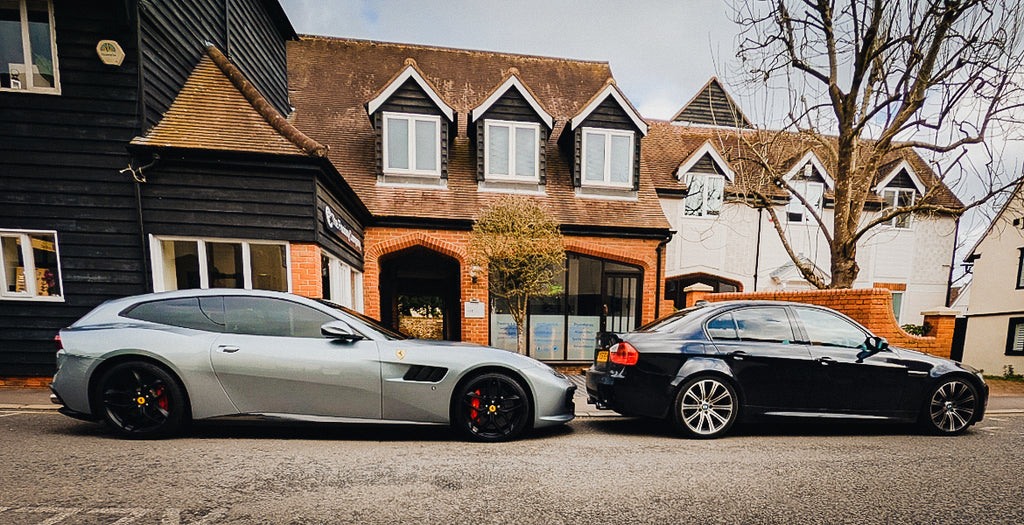 Side shot of a Ferrari FF and a BMW E90 M3