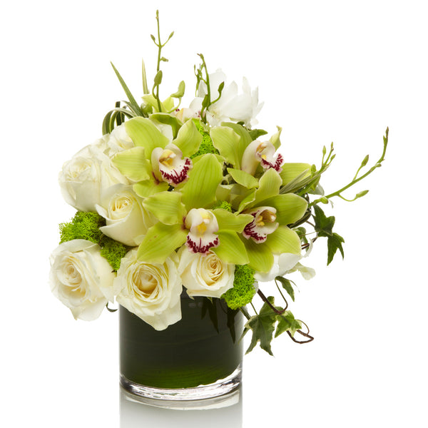 Freshy by H.Bloom is a white rose and green orchid arrangement.