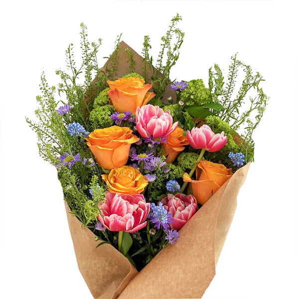 A vibrant flower bouquet featuring tulips and roses in bright spring colors, called Wild Child by H.Bloom.