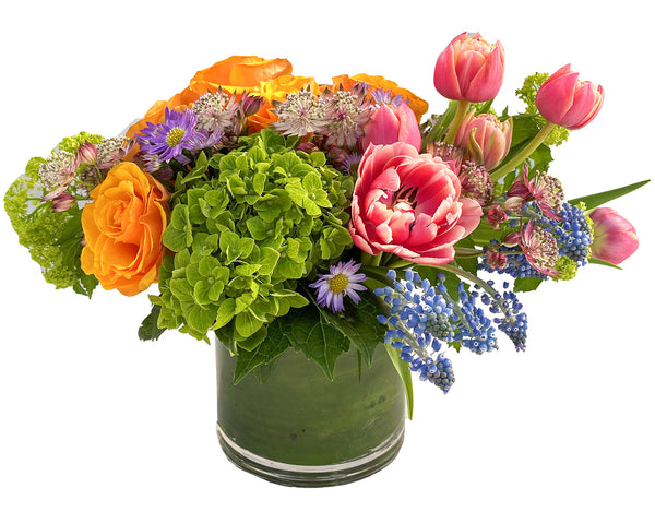 Spring Fever is a vibrant peony, hydrangea, and tulip floral arrangement by H.Bloom.