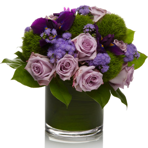 Violette by H.Bloom is a unique floral design featuring mixed purple flowers.