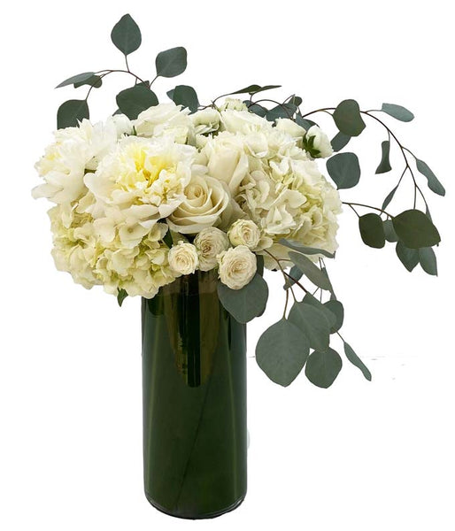 A dreamy tall floral arrangement with white roses and soft greenery, called Clouds by H.Bloom.