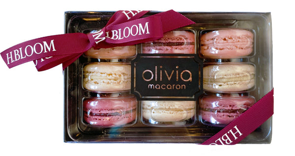 Sweet pink and white macarons by Olivia Macaron for Breast Cancer Awareness Month.