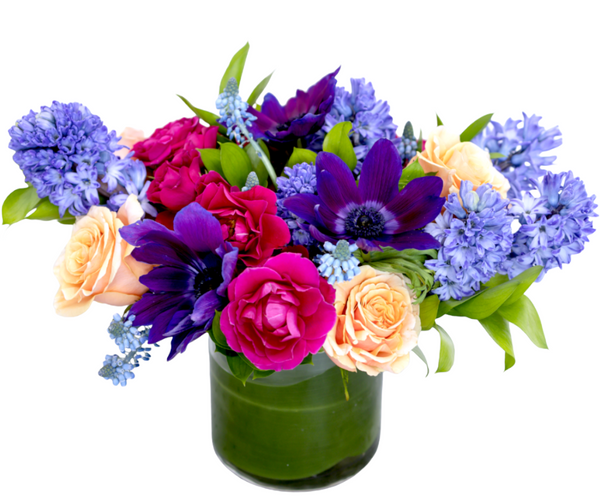 Dallas by H.Bloom is a vibrant floral arrangement featuring pink, purple, and peach florals.