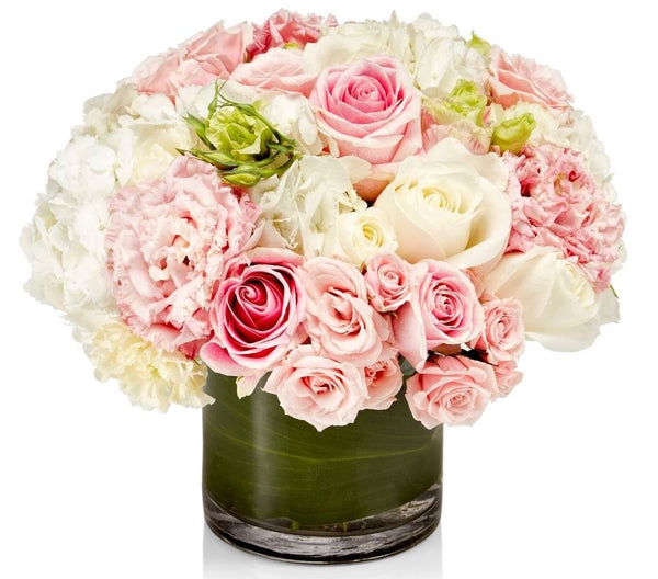 White and pink fresh flowers in an arrangement called Pink Ruffles by H.Bloom.