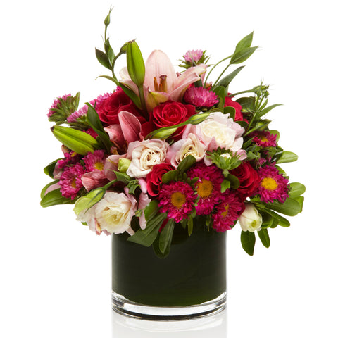 A blush and magenta floral arrangement by H.Bloom, called Pink Wildflower.
