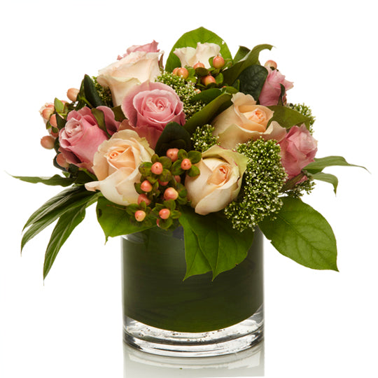 A blush and pink rose floral arrangement with accented greenery, called Dusty Rose by H.Bloom.
