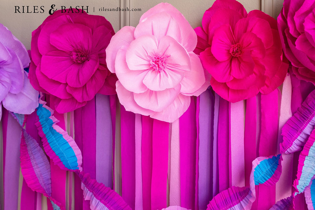 Riles & Bash Pink & Purple Streamer Backdrop with Crepe Paper Flowers