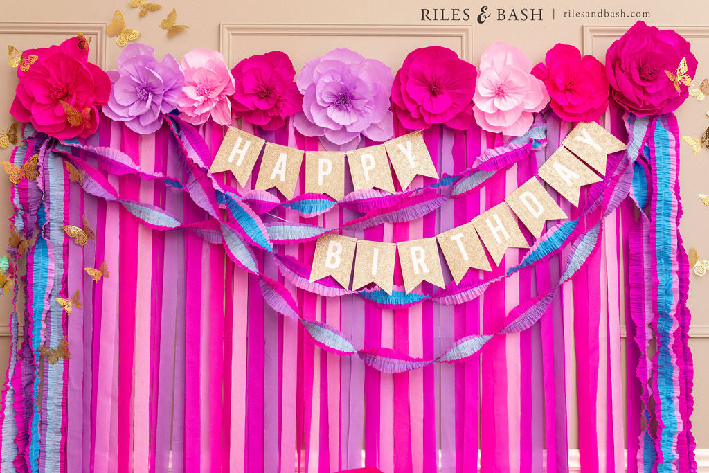 Riles & Bash Enchanted Pink & Purple Streamer Backdrop with Ruffled Streamers and Crepe Paper Flowers for an Enchanted Pink & Purple Butterfly Garden Party