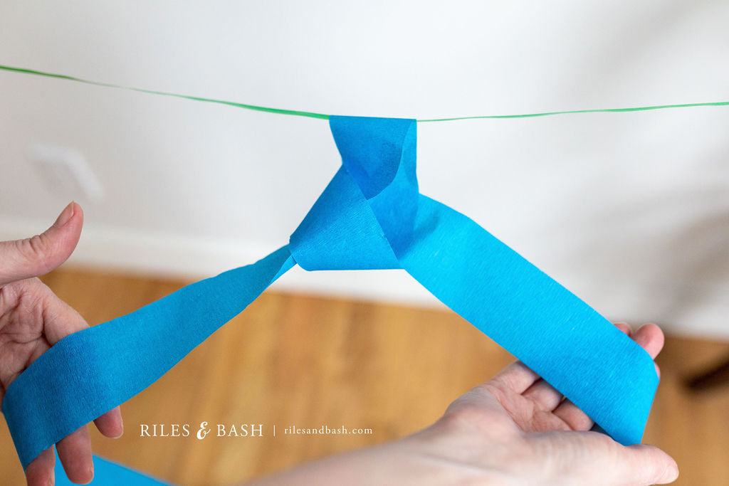 Riles & Bash Fiesta Mexican Streamer Backdrop with Crepe Paper Fiesta Flowers_How to Build a Fiesta Backdrop_Cinco De Mayo_Fiesta_Taco Bar Party_Riles & Bash Party