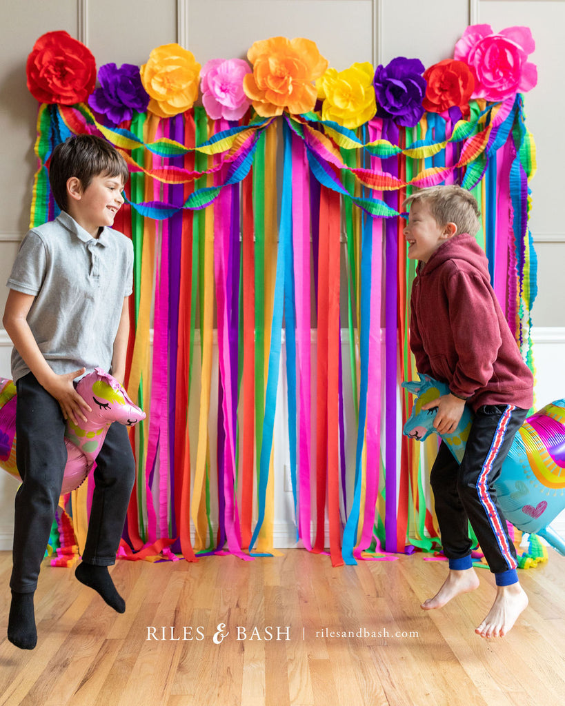 Riles & Bash Fiesta Mexican Streamer Backdrop with Crepe Paper Fiesta Flowers_How to Build a Fiesta Backdrop_Cinco De Mayo_Fiesta_Taco Bar Party_Riles & Bash Party