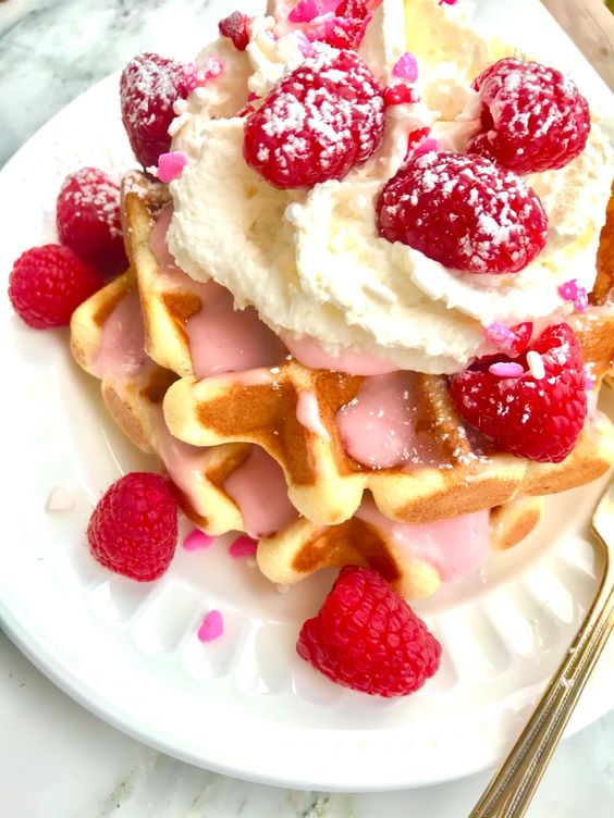 Valentine's Day Waffles with whipping cream and raspberries_photo great taste buds