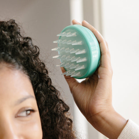 Aveda scalp massager, recommended for nighttime hair routine 