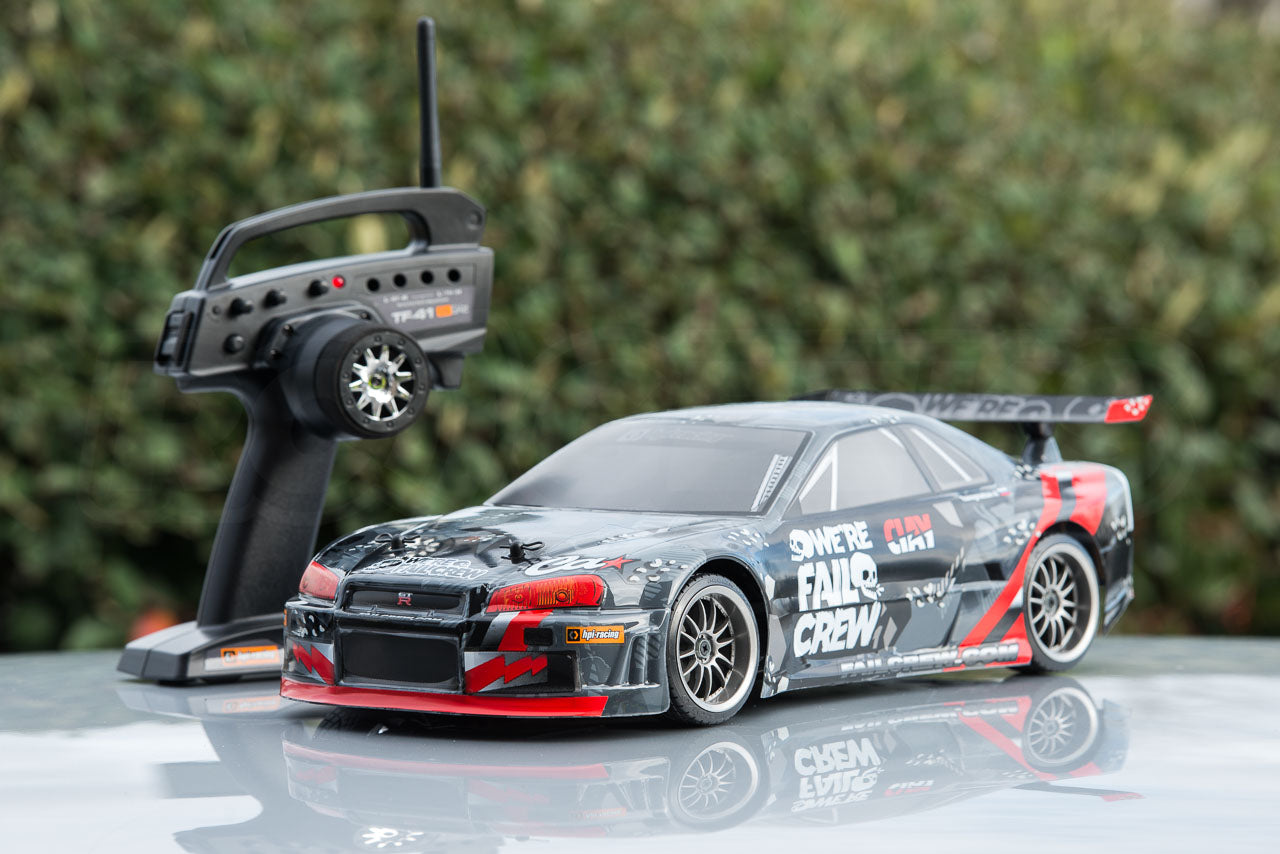 HPI Racing E10 Drift Nissan GT-R R34 Review with transmitter on reflective surface