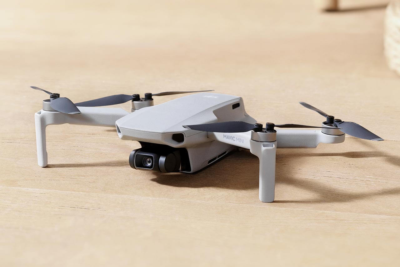 mavic mini uk launch drone on wooden table