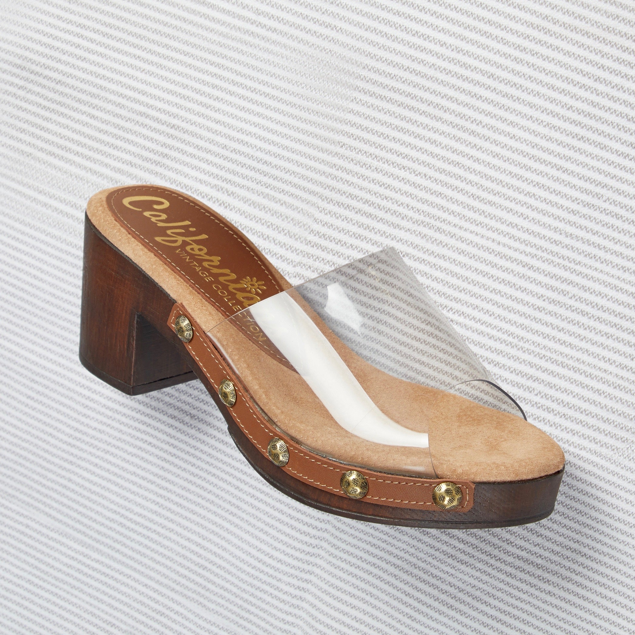 Claire low-heeled slide trimmed with studs with a clear upper