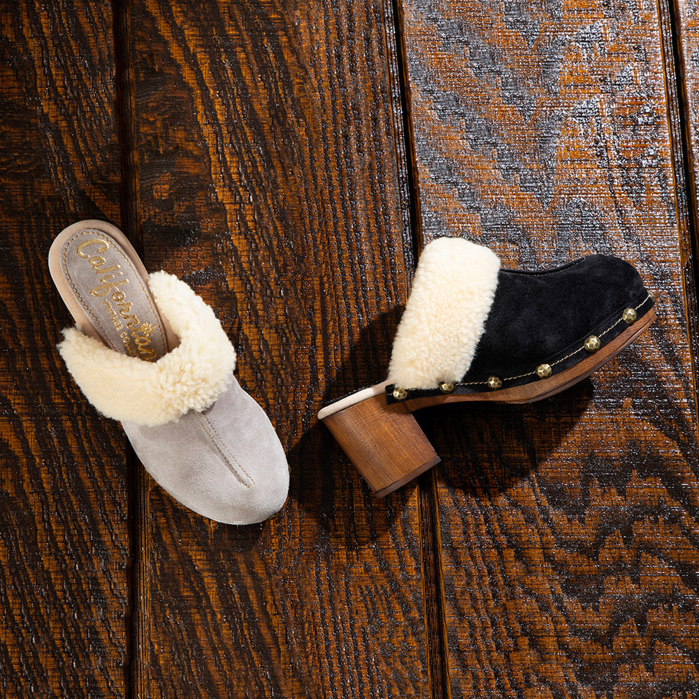 pair of greta closed-toed clogs in stone suede with fur trim