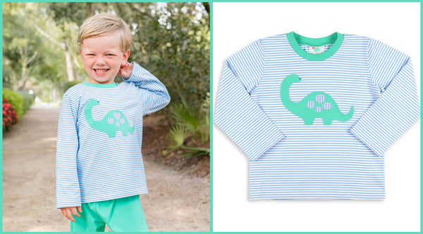 little boy in a dinosaur shirt smiling at the camera - the teal pumpkin project