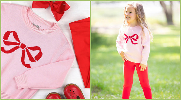 pink sweater with a red bow and red pants and a little girl in a red bow