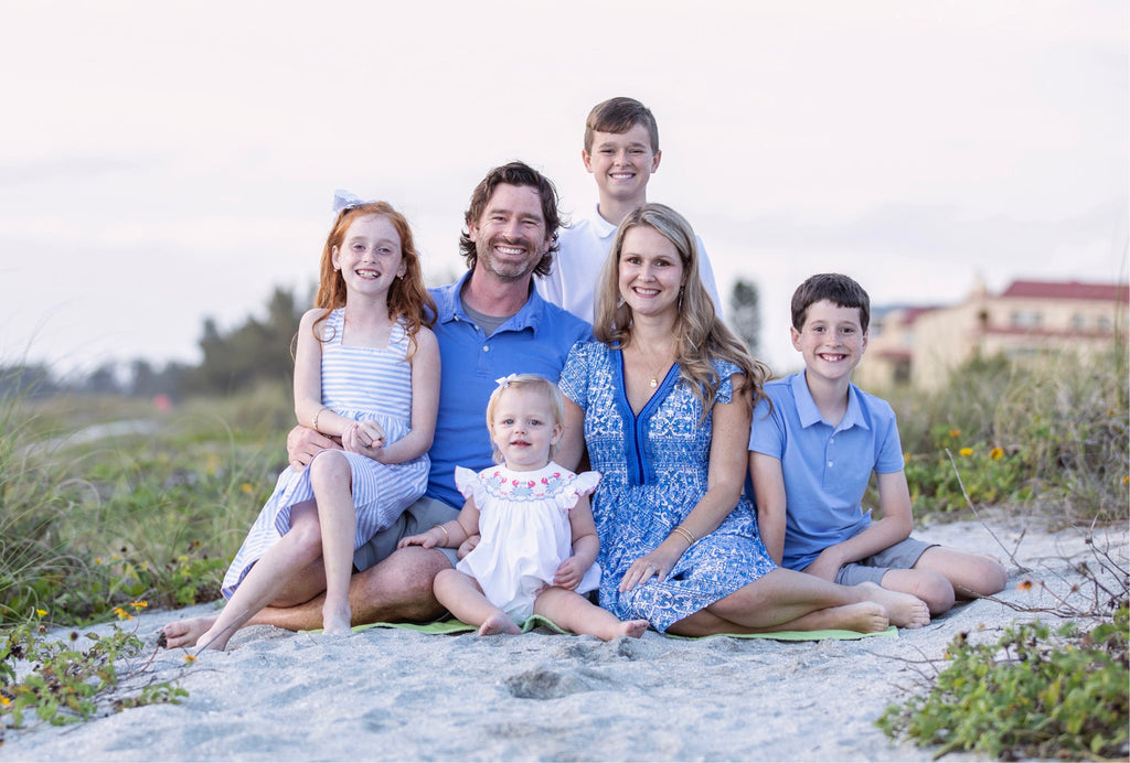 beautiful family of 6, mom dad, 2 daughters and 2 sons on the beach - Q and A With Amilee Sanders - Shrimp and Grits Kids Hostess