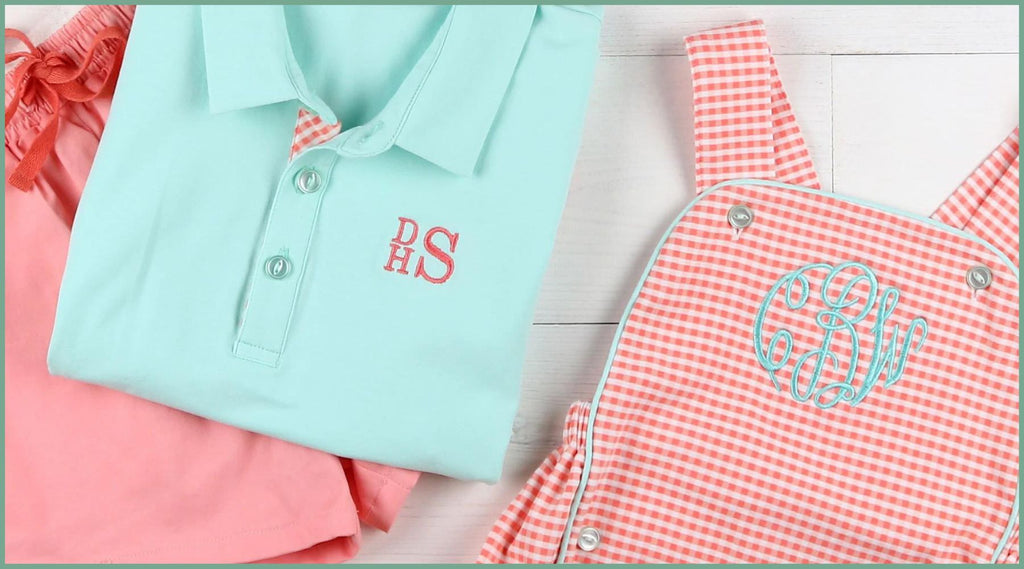 flaylay of monogrammed aqua shirt and red bubble jumper