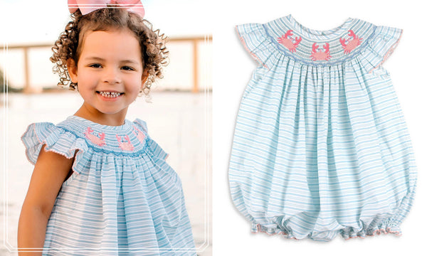 little girl wearing a smocked crab bubble