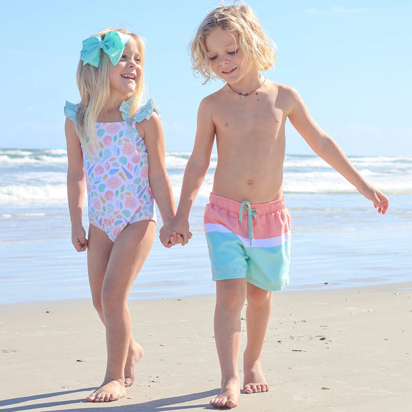 little boy and girl at the beach holding hands - Kids Summer Clothes Drop