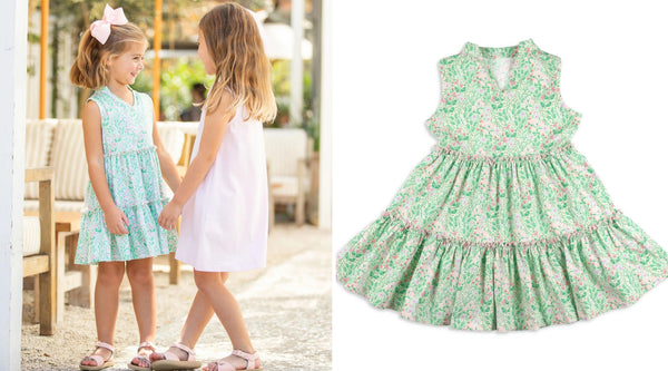2 little girls in dresses smiling at each other - Kids Spring 2024 Clothing Collection