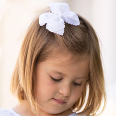 white scallop bow in little girl's hair