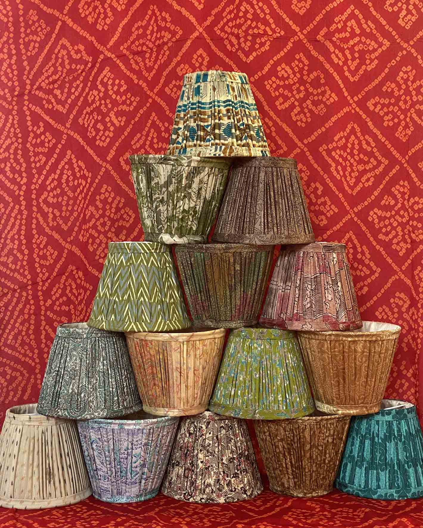 15cm lampshade tower against a red sari background
