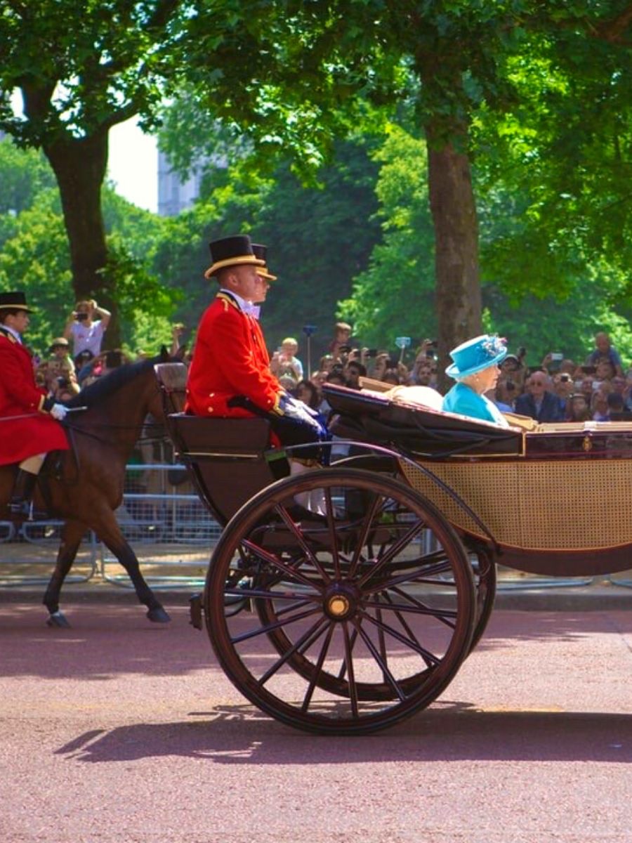 Queen Elizabeth II Rides Along the Mall towards Buckingham Palace in London, England